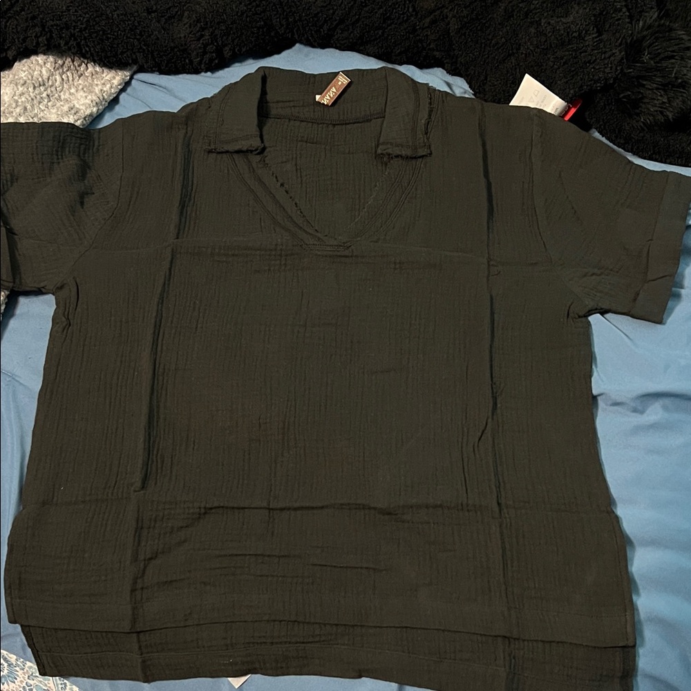 Woman’s Casual Black Shirt
Oversized, raw edges, v-neck